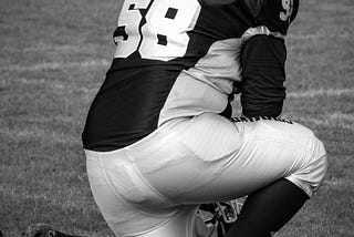 Football player praying