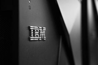 IBM logo on a dark grey wall