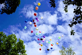 Balloons are hovering effoertless in the air.