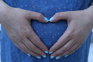 A heart over a growing life.