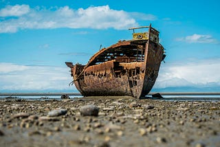 Wrecked ship on land.