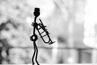 An art piece of a man holding a trumpet