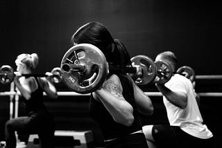 Weightlifting class in black and white.