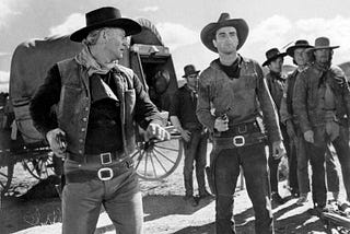 a black and white gunfight scene form an old western movie (conflict resolution and writing
