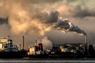 photo of smoke going into the air from a ship