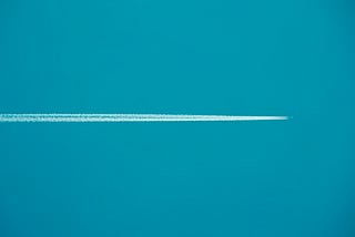 plane going through a blue azure sky