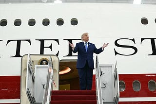 President Donald Trump steps out of the VC-25B Bridge, a modified Boeing 747–800, which will now serve as Air Force One, on Friday, June 19, 2026.