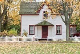 House displayed in Autumn foliage.