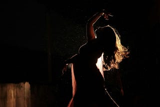 Dancer in profile on stage