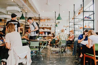 People dining and working in a restaurant.