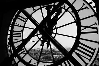 View of a tower clock from inside the building to the outside.