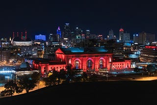 Kansas City Union Station at night lit in red lights