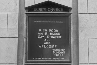 A sign outside of Trinity Church. It says: “Rich, Poor, White, Black, Gay, Straight- All Are Welcome.”