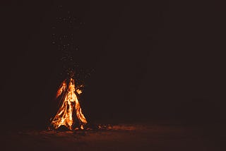 A big fire appearing like a woman, at night.