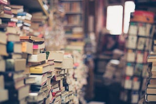 Stack and stack of books, slighty out of focus