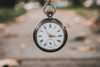 Stopwatch with a road in the background.