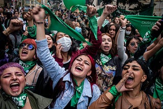 Group of activists holding green