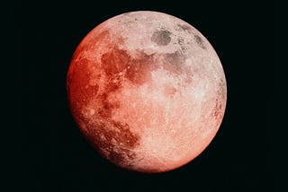 A moon tinged with red