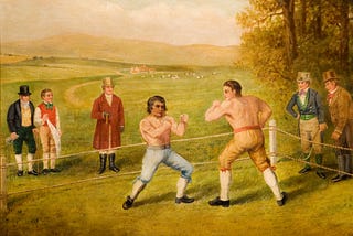 A painting of two men fighting while onlookers watch, titled “A Birmingham Prize Fight”, 1789 By W Allen.
