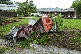 Damaged appliances and other natural debris from a hurricane storm surge.