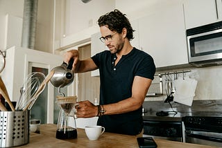 man making fresh coffee