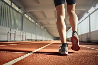 An image of an individual walking on tracks.