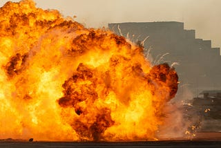 Massive fire explosion close up in military combat and war. Vehicle explosion from a tank in a city in the Middle East. Military Concept. Strength, power, explosion.