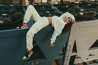 Calm woman lying on air conditioner system