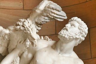 Marble Greek statue of man and eagle.