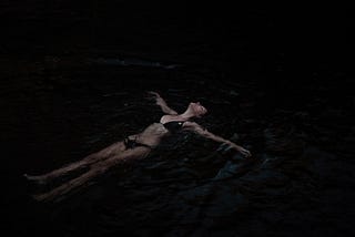 A woman floating in water.