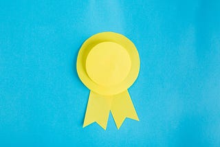 A gold ribbon on a blue background.