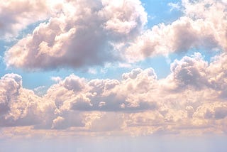 Fluffy clouds in a blue sky