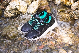 Tropicfeel shoes in a river