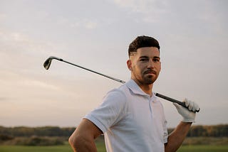 Rich man playing golf