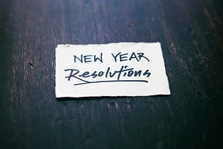 New year resolutions written on a paper