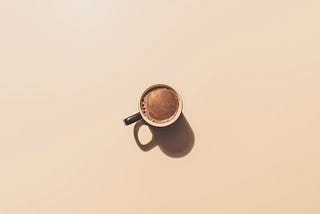 A cup of hot coffee with solid background