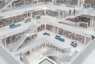 a multi-level library with books on the shelves