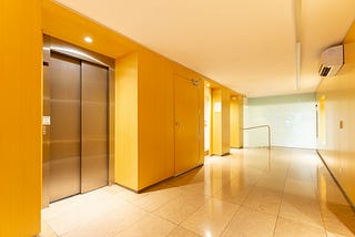 Elevators and a gleaming corridor