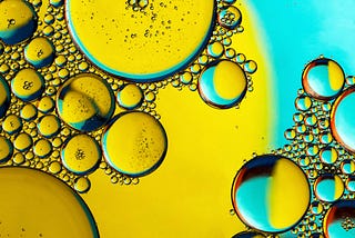 A close-up view of droplets of olive oil.