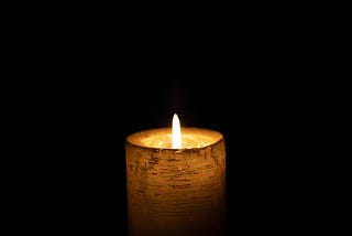 one candle with a sturdy flame