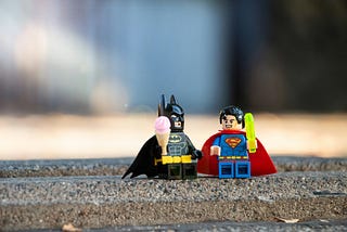 Superhero team collaborating with Dependency Injection for JavaScript development