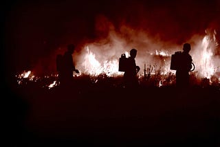 Firefighters battle a blaze.