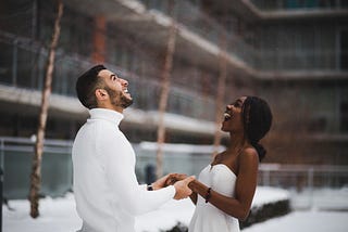 A man and a woman holding hands.