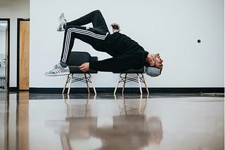 a man exercising in an upside down stance