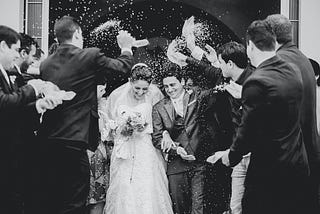 Rice thrown at a couple getting married