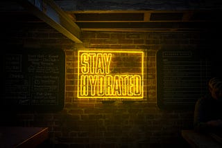 Neon sign that says “Stay Hydrated”