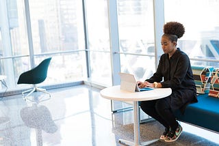 Woman at work, wearning sneakers.