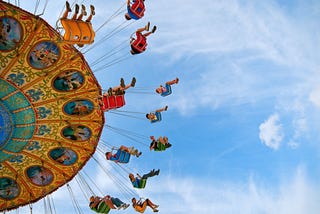 A picture of a giant, colorful merry-go-round from below