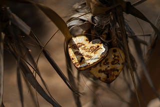 Close up photo of a tarnished heart locket.