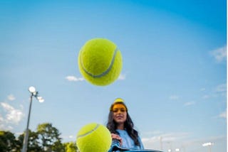 Being tennis captain and what it means, woman bouncing tennis balls on racket